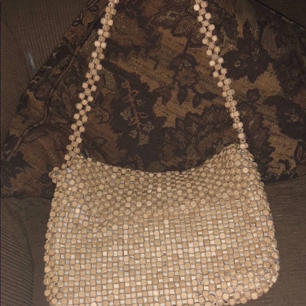 Beige beaded purse.